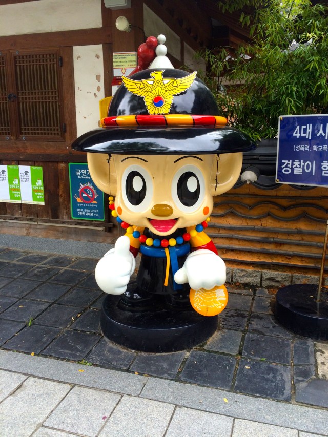 the police mascot wearing traditional Korean clothing